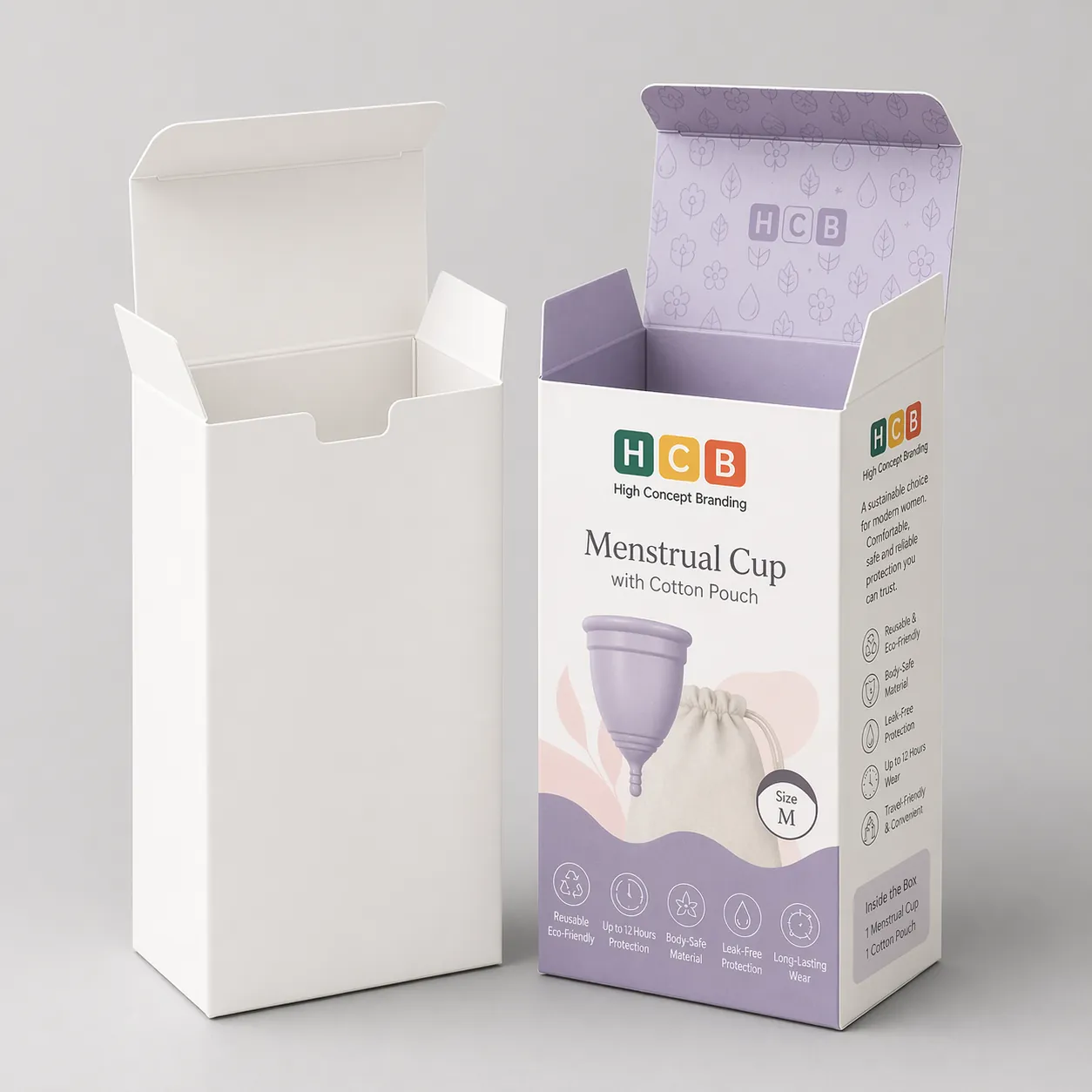 Two upright cardboard boxes, one plain white and one with pink floral branding for menstrual cups.